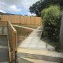 New handrail and paved paths and outdoor areas in backyard