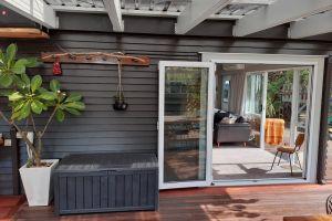 Installation of new double glazed aluminium bi-fold door providing a new wide access to outdoor deck area.