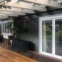 Installation of new double glazed aluminium bi-fold window and door joinery to deck .