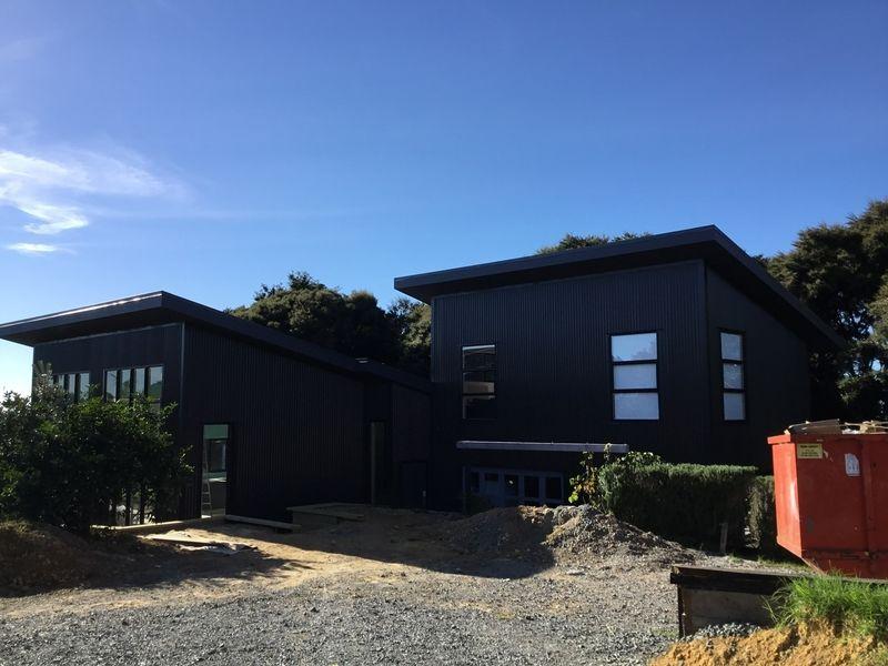 Completion of house extension and recladding of original house.