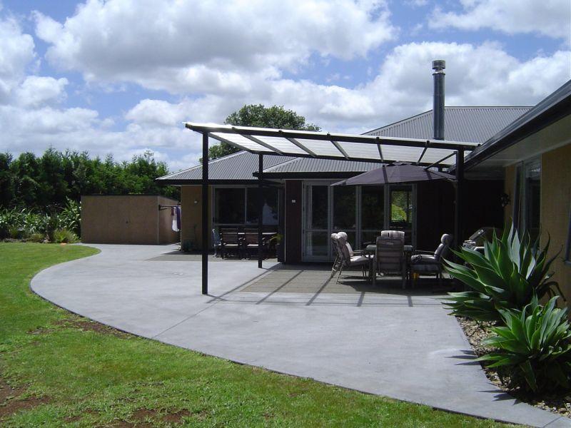 Builder for Steel framed pergola over outdoor area at home.